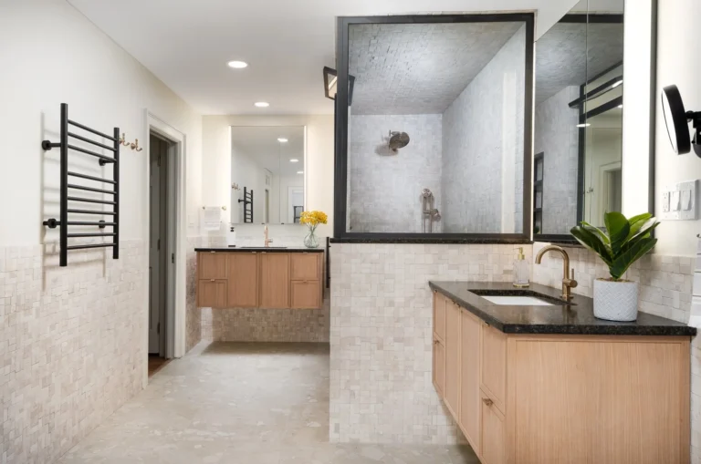 Serene primary bathroom with modern tile and decor by Armitage Interiors